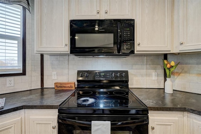 177074 Stephens Rd, Duncan, OK 73533 - kitchen featuring black appliances, dark countertops, and decorative backsplash