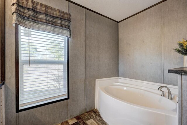 177074 Stephens Rd, Duncan, OK 73533 - full bathroom featuring crown molding, wood finished floors, and a bath