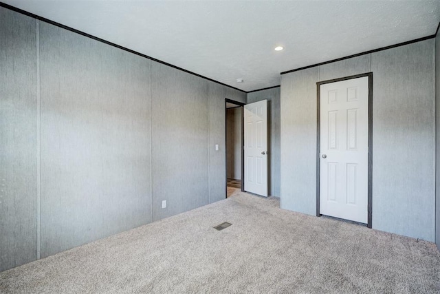 177074 Stephens Rd, Duncan, OK 73533 - unfurnished bedroom featuring carpet floors, ornamental molding, and recessed lighting
