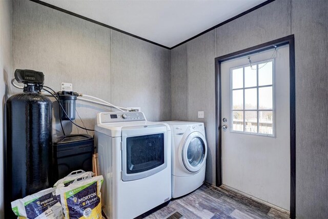 177074 Stephens Rd, Duncan, OK 73533 - washroom featuring washer and dryer, wood finished floors, and crown molding