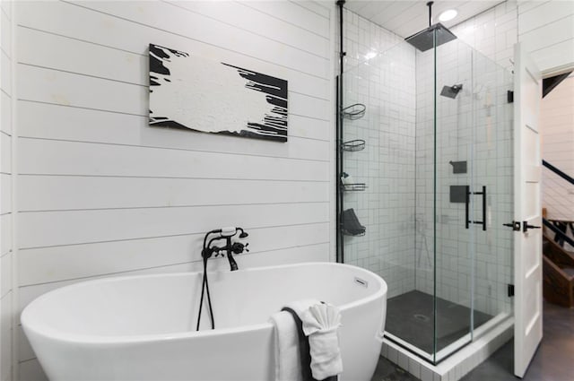 2690 Sweet Home Rd, Broken Bow, OK 74728 - bathroom with a stall shower, a freestanding tub, and wooden walls