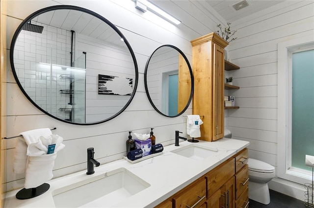 2690 Sweet Home Rd, Broken Bow, OK 74728 - full bathroom with double vanity, tiled shower, toilet, and wooden walls