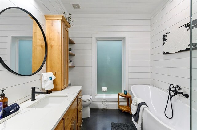 2690 Sweet Home Rd, Broken Bow, OK 74728 - full bathroom featuring a bathtub, vanity, wood walls, toilet, and concrete floors