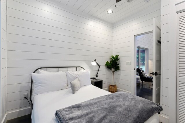 2690 Sweet Home Rd, Broken Bow, OK 74728 - bedroom featuring wood walls, recessed lighting, and wooden ceiling