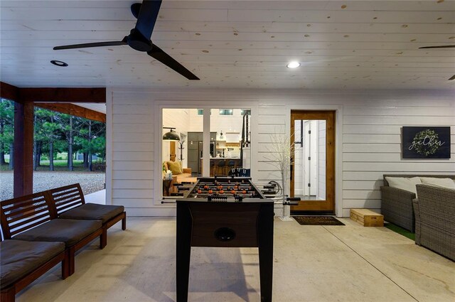 2690 Sweet Home Rd, Broken Bow, OK 74728 - game room with ceiling fan, wooden walls, and recessed lighting