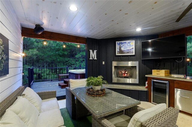 2690 Sweet Home Rd, Broken Bow, OK 74728 - view of patio featuring wine cooler, an outdoor living space, a hot tub, and a wooden deck