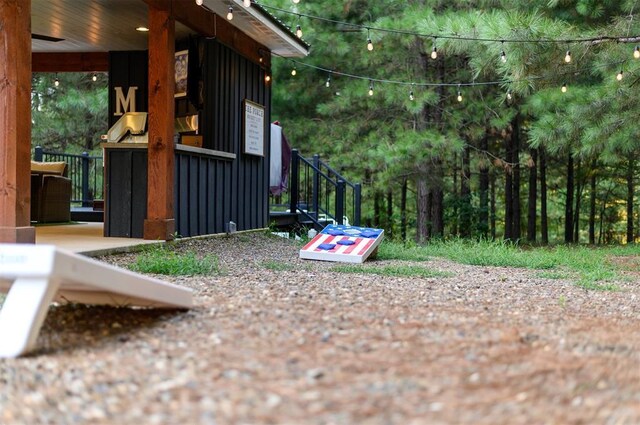 2690 Sweet Home Rd, Broken Bow, OK 74728 - view of property exterior with board and batten siding and stairs