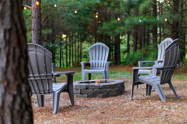 2690 Sweet Home Rd, Broken Bow, OK 74728 - view of yard featuring an outdoor fire pit