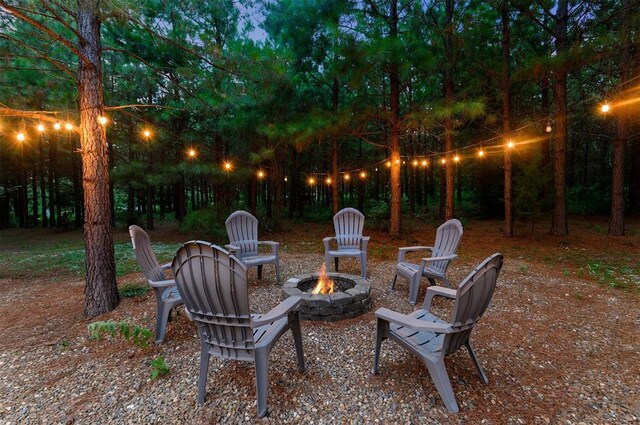 2690 Sweet Home Rd, Broken Bow, OK 74728 - view of patio / terrace with a fire pit
