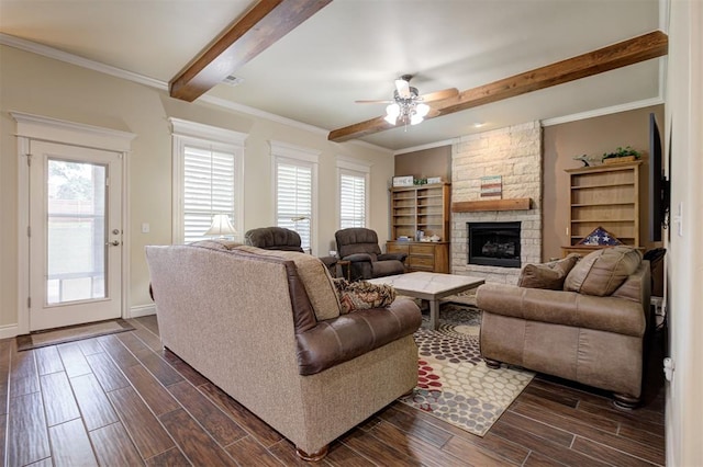 3327 Bobcat Trl, Guthrie, OK 73044 - living room with beam ceiling, a stone fireplace, dark wood-type flooring, a ceiling fan, and crown molding