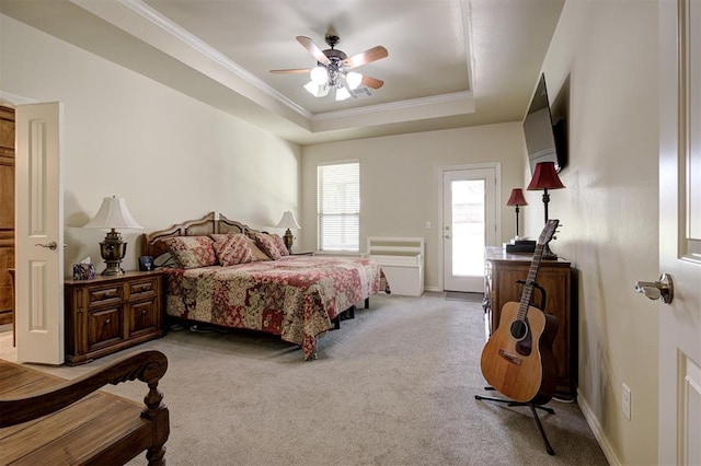 3327 Bobcat Trl, Guthrie, OK 73044 - bedroom featuring light colored carpet, ornamental molding, a tray ceiling, a ceiling fan, and access to exterior