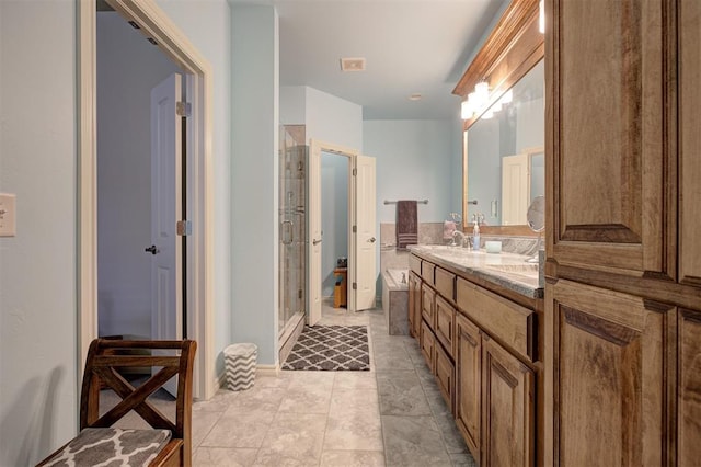 3327 Bobcat Trl, Guthrie, OK 73044 - full bath featuring double vanity, a stall shower, and tile patterned floors