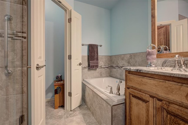 3327 Bobcat Trl, Guthrie, OK 73044 - full bath featuring vanity, a tub with jets, a shower stall, and tile patterned floors