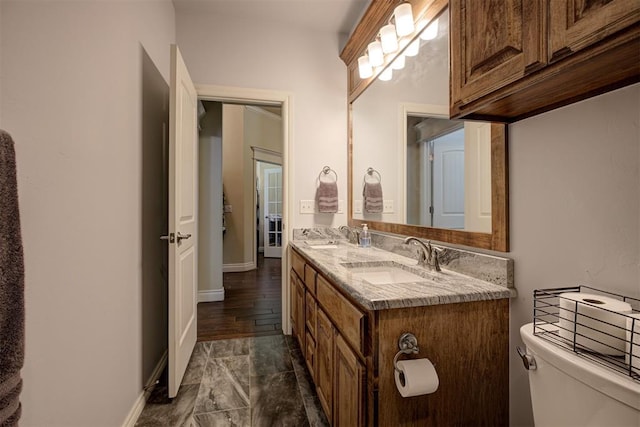 3327 Bobcat Trl, Guthrie, OK 73044 - bathroom featuring toilet and double vanity
