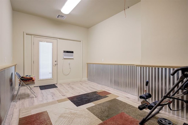 3327 Bobcat Trl, Guthrie, OK 73044 - entryway with wood finished floors and a wall mounted air conditioner