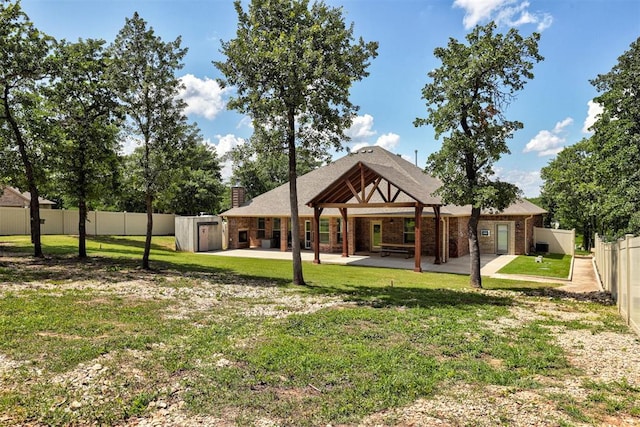 3327 Bobcat Trl, Guthrie, OK 73044 - back of house featuring a patio, a fenced backyard, and brick siding