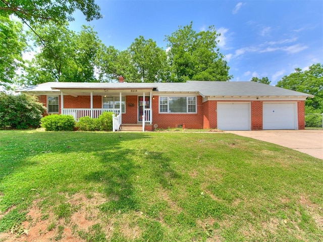 5015 S Shartel Ave, Oklahoma City, OK 73109 - single story home with covered porch, an attached garage, driveway, a front yard, and brick siding