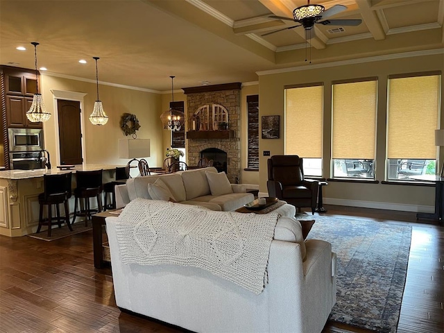 10921 SW 20th St, Yukon, OK 73099 - living area with a ceiling fan, recessed lighting, ornamental molding, dark wood-type flooring, and a fireplace