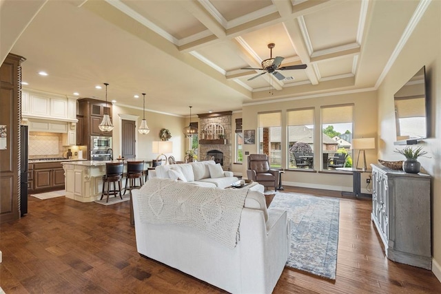 10921 SW 20th St, Yukon, OK 73099 - living room with ceiling fan, a fireplace, recessed lighting, crown molding, and beam ceiling