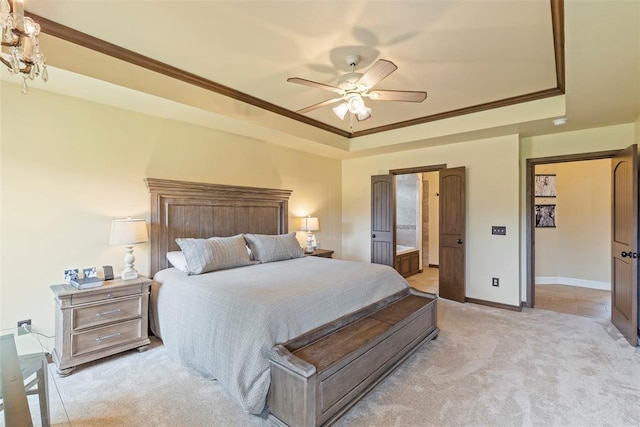 10921 SW 20th St, Yukon, OK 73099 - bedroom featuring a raised ceiling, ornamental molding, light carpet, baseboards, and ensuite bath
