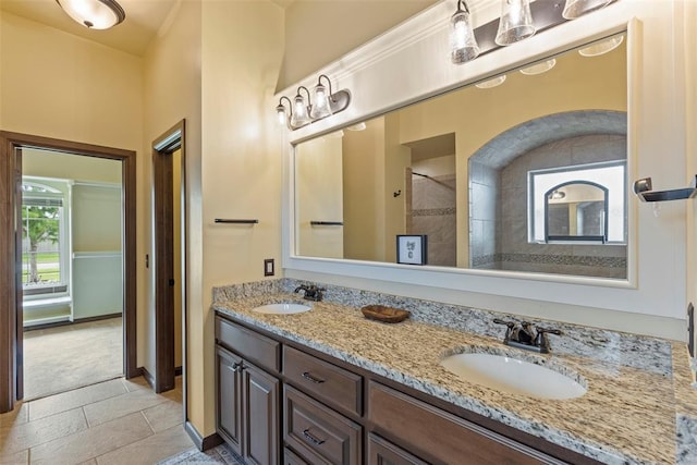 10921 SW 20th St, Yukon, OK 73099 - full bath featuring double vanity, baseboards, and a shower