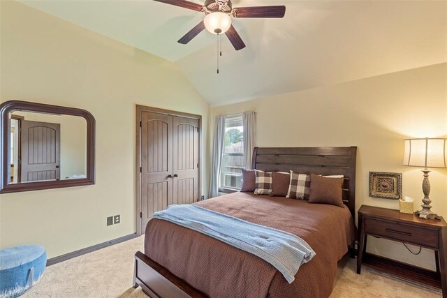 10921 SW 20th St, Yukon, OK 73099 - bedroom with light colored carpet, lofted ceiling, a closet, a ceiling fan, and baseboards