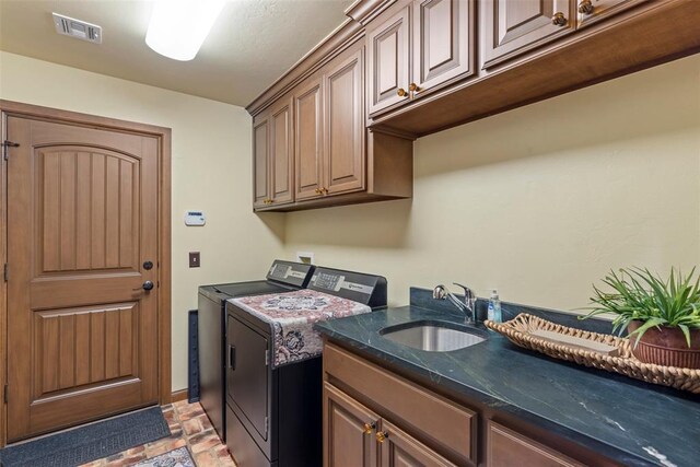 10921 SW 20th St, Yukon, OK 73099 - washroom with washing machine and clothes dryer, cabinet space, light stone finish flooring, and baseboards