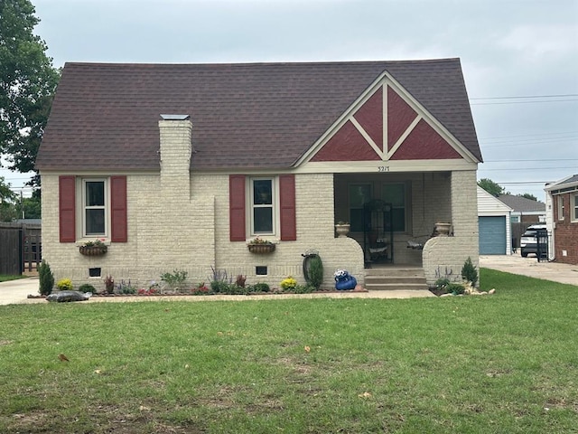 3217 NW 22nd St, Oklahoma City, OK 73107 - view of front facade featuring covered porch, roof with shingles, and a front yard