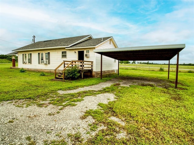 344020 E 760th Rd, Agra, OK 74824 - view of front of property with driveway, a front yard, a deck, and a detached carport
