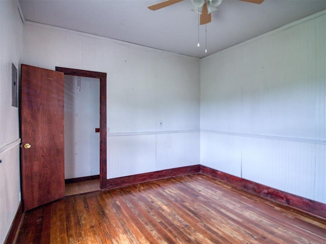 344020 E 760th Rd, Agra, OK 74824 - unfurnished room with hardwood / wood-style floors, a ceiling fan, electric panel, and a wainscoted wall