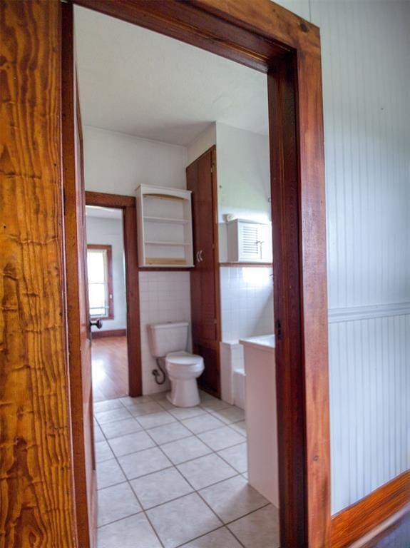 344020 E 760th Rd, Agra, OK 74824 - bathroom with tile patterned flooring, toilet, and a wainscoted wall