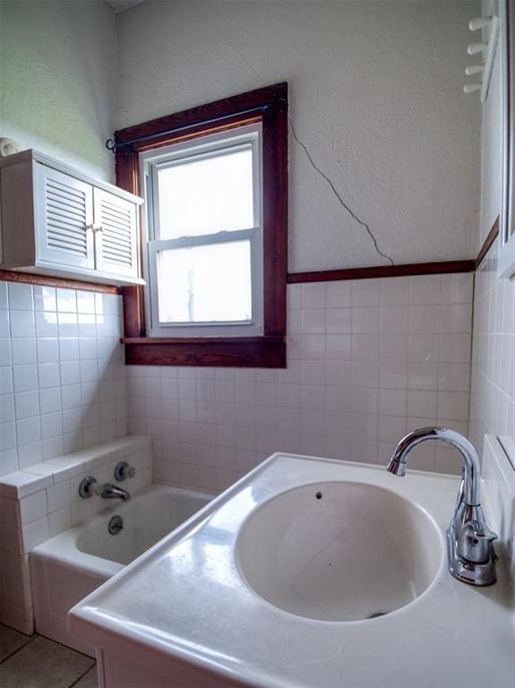 344020 E 760th Rd, Agra, OK 74824 - bathroom with tile walls, a sink, and a bath