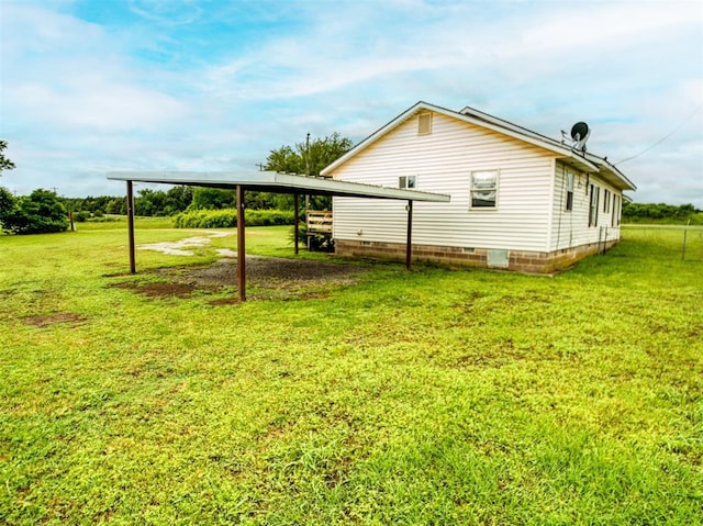 344020 E 760th Rd, Agra, OK 74824 - view of side of property featuring a yard, a carport, driveway, and crawl space