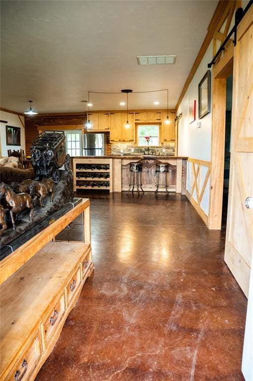 16301 Lewis Rd, Lexington, OK 73051 - living room with a barn door and crown molding