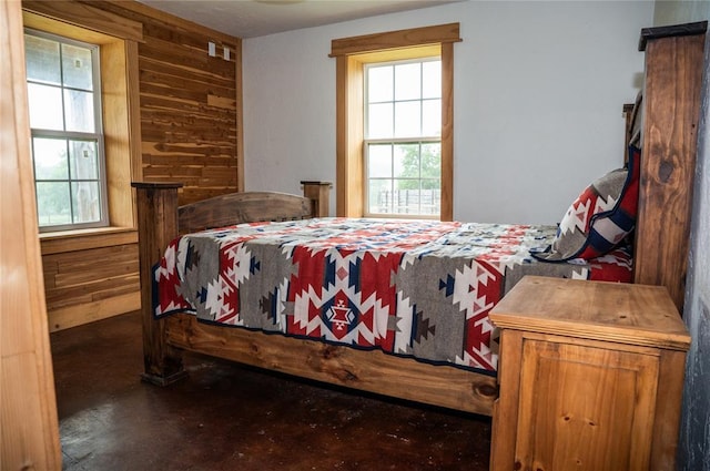16301 Lewis Rd, Lexington, OK 73051 - bedroom featuring concrete floors, multiple windows, and wooden walls