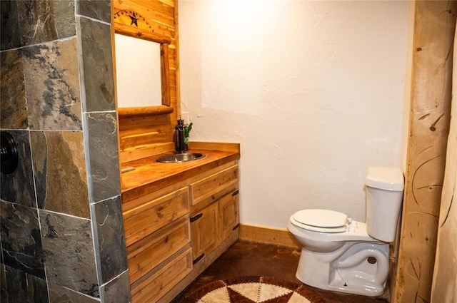 16301 Lewis Rd, Lexington, OK 73051 - full bathroom featuring vanity, toilet, baseboards, concrete floors, and a shower