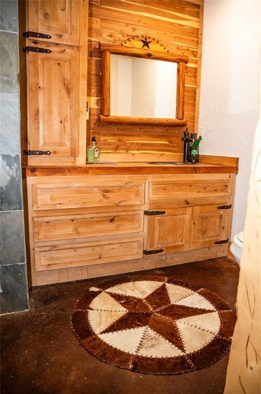 16301 Lewis Rd, Lexington, OK 73051 - bathroom with wood walls, vanity, and toilet
