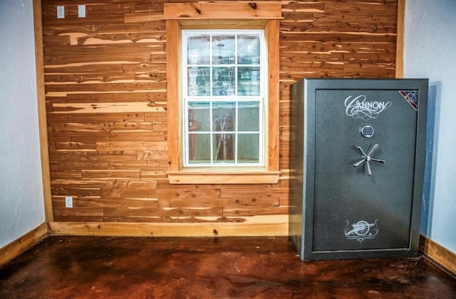 16301 Lewis Rd, Lexington, OK 73051 - detailed view of wood walls, baseboards, and concrete flooring