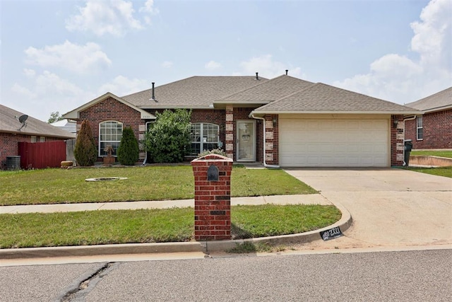2333 Berry Ln, Midwest City, OK 73130 - view of front of home featuring an attached garage, concrete driveway, brick siding, a shingled roof, and central AC unit