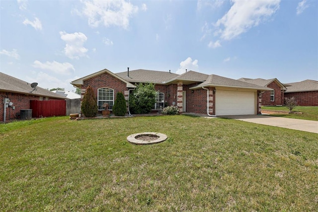 2333 Berry Ln, Midwest City, OK 73130 - view of front facade featuring an attached garage, brick siding, concrete driveway, and cooling unit