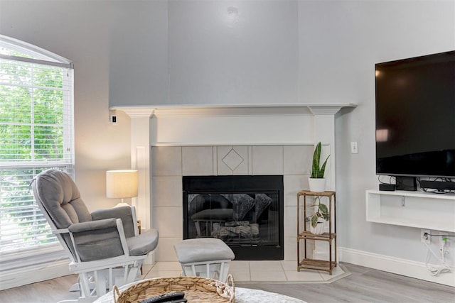 2333 Berry Ln, Midwest City, OK 73130 - detailed view of wood finished floors, a fireplace, and baseboards