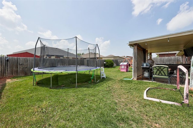 2333 Berry Ln, Midwest City, OK 73130 - view of yard with a trampoline