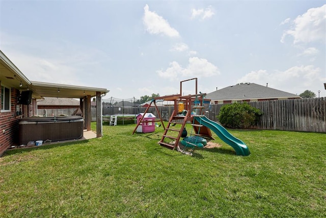 2333 Berry Ln, Midwest City, OK 73130 - view of jungle gym with a trampoline and a hot tub