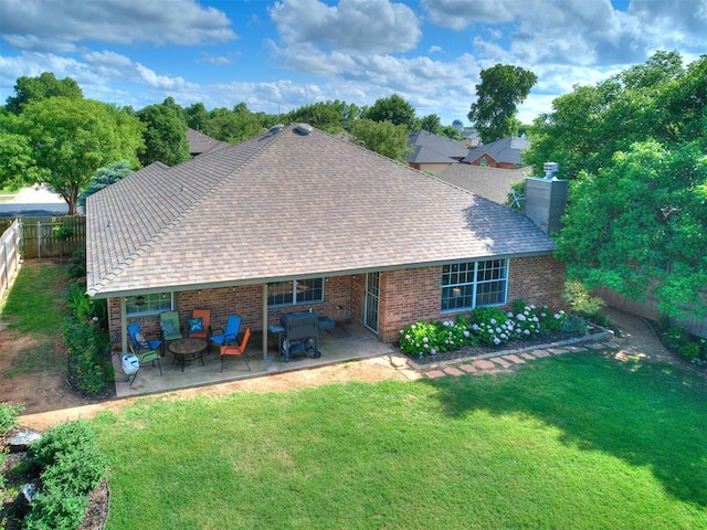 4409 Newport Dr, Norman, OK 73072 - back of house featuring a patio, a chimney, roof with shingles, and brick siding