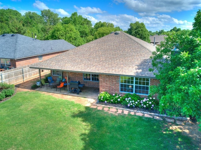 4409 Newport Dr, Norman, OK 73072 - rear view of house with a patio, roof with shingles, and brick siding