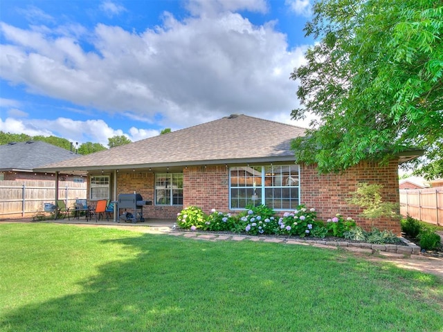 4409 Newport Dr, Norman, OK 73072 - back of house featuring brick siding, a patio, and roof with shingles