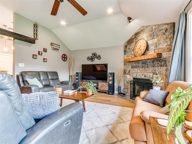 4409 Newport Dr, Norman, OK 73072 - living area featuring lofted ceiling, wood finished floors, ceiling fan, and a stone fireplace