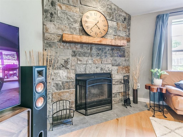 4409 Newport Dr, Norman, OK 73072 - detailed view of wood finished floors, a fireplace, and baseboards