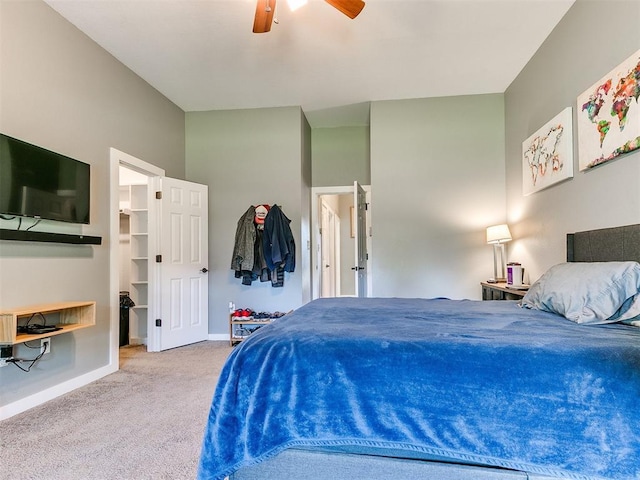 4409 Newport Dr, Norman, OK 73072 - bedroom with baseboards, carpet, a spacious closet, and a ceiling fan