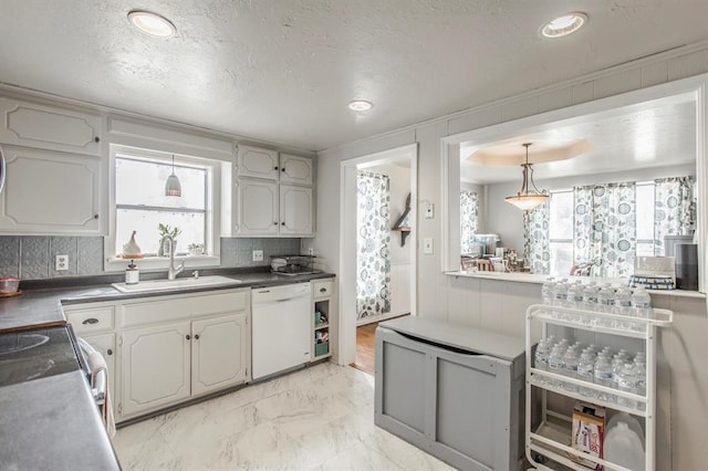1505 N Piedmont Rd, Yukon, OK 73099 - kitchen featuring dishwasher, a sink, tasteful backsplash, a textured ceiling, and light marble finish flooring